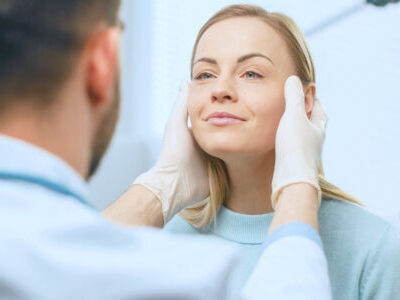 plastic surgeon with patient